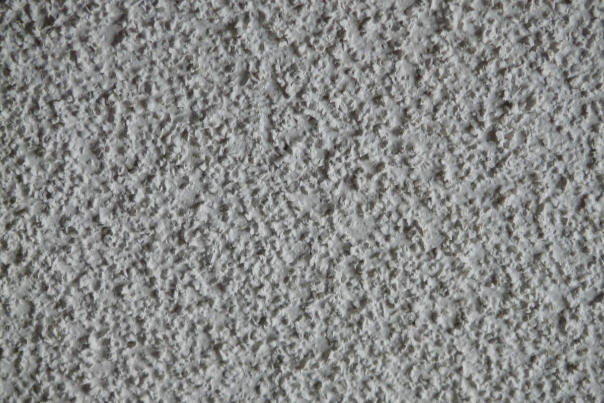 Close-up of a white popcorn ceiling texture